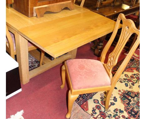 A contemporary light oak drawleaf refectory table, raised on square cut supports, max length 269cm; together with a set of ei