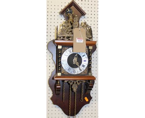 A reproduction walnut and brass Dutch wall clock, having two brass teardrop weights