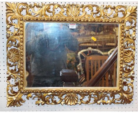 A 19th century Florentine floral carved gilt wood framed rectangular wall mirror (some losses and damages), 50 x 64cm