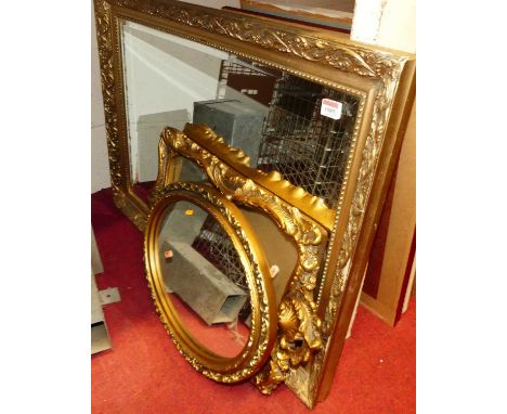 A gilt composition framed rectangular wall mirror, 63 x 87cm; together with two other smaller examples (3)