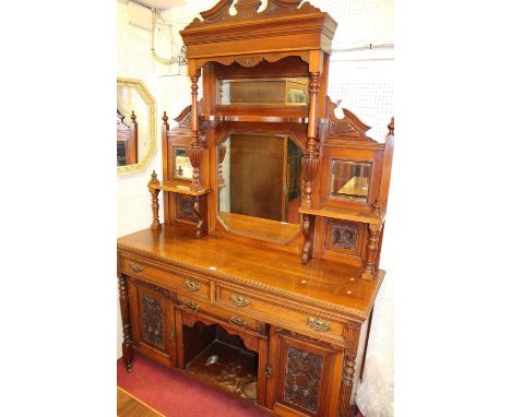 An Edwardian floral relief carved walnut bevelled mirror back sideboard, width 151cm
