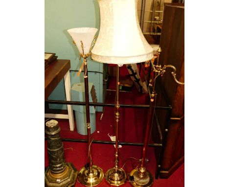 A reproduction lacquered brass lamp stand with pleated silk shade, one other again with silk shade, and one other with froste