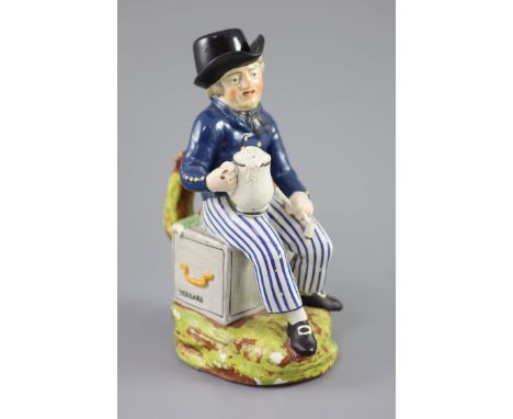 An American Pearlware sailor Toby jug with hat, 'Success to our Wooden Walls, c.1820, on a naturalistic base with similar han