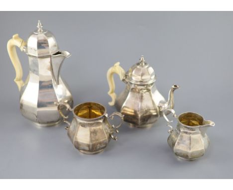 A late Victorian silver four piece Queen Anne style octagonal tea service by Elkington &amp; Co, with ivory handles, London, 