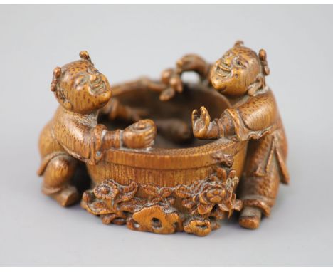 A fine and rare Chinese bamboo-root 'boys and fish bowl' brush washer, 18th/19th century, carved in the round from a bamboo-r