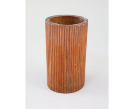 An unusual Chinese reeded bamboo brushpot, bitong, 18th/19th century, of oval section, warm caramel patina, 14cm high.Provena