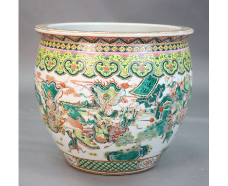 A large Chinese famille verte goldfish bowl, late 19th century, the exterior well-painted with a battle scene in a continuous