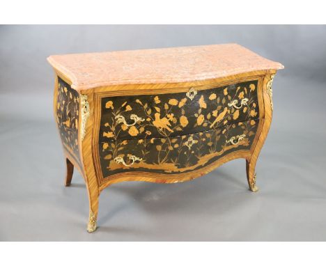 A French Louis XV style kingwood and ormolu mounted serpentine bombe commode, with veined pink marble top, two drawers and sw