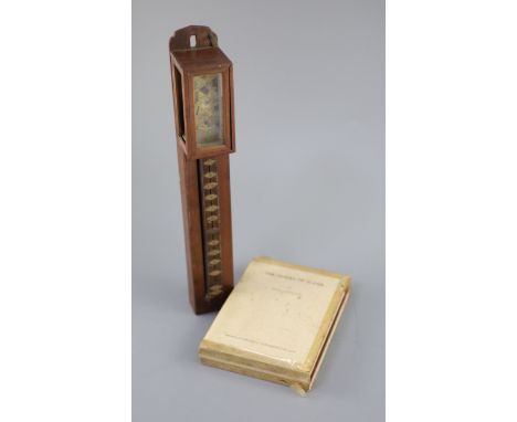 A Japanese shitan wood wall clock, shoku dokei, 19th century, 38cm high, together with a book on Japanese clocks Provenance -