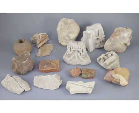 A group of English medieval church/priory architectural stonework and tile fragments, some pieces with inscribed labels of pr