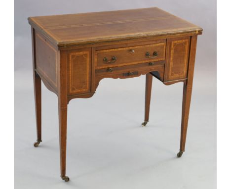 An Edwardian satinwood banded mahogany games/drinks table,&nbsp;with twin flap swivelling top concealing compartment containi