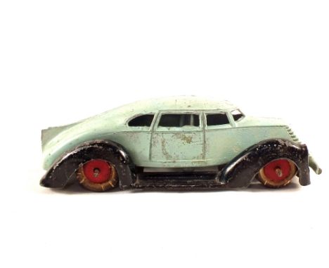 A manual U.S.A. Futuristic die cast car with wood wheels