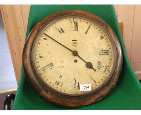 A GRVI round stained pine wall clock by Smiths with R.A.F. and Crown on dial, with case marked 1943
