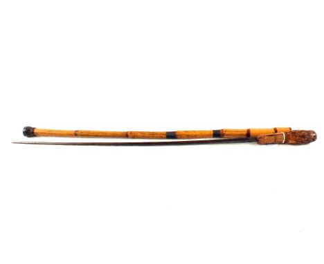 A vintage sword stick with bamboo scabbard