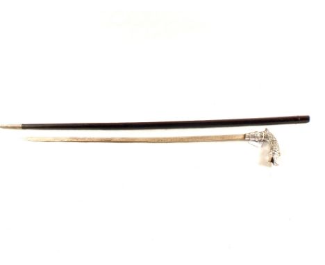 A vintage sword stick with stylised fish grip