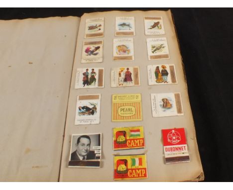 An album of various Matchbox covers and a stamp album
