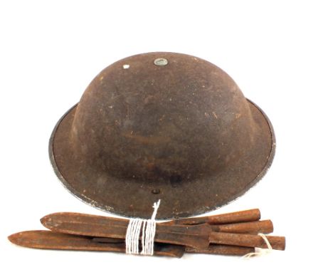 A tin helmet plus four spear tips