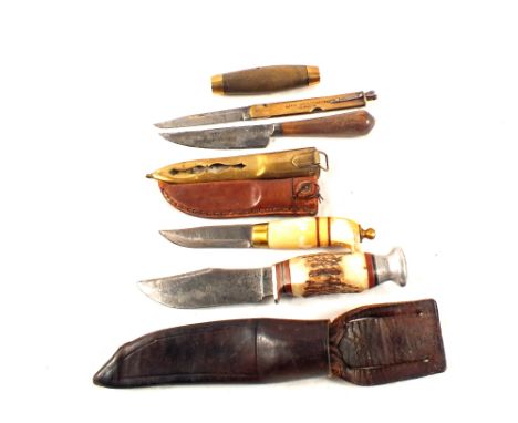 Three various hunting knives including Sheffield and Norwegian examples with an unusual lock knife within scabbard/grip by Me