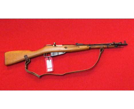 A Mosin-Nagant 7.62 x 54 carbine with integral bayonet and original sling, all matching numbers (C43699) and dated 1951 in ov