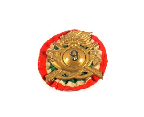 A WWII era Italian Infantry hat badge 'bearing number 9'