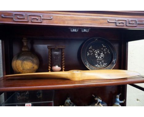 A small group of treen, comprising: a small propeller 76cm long; an olive wood sand timer, 19.5cm high, a turned wood pilgrim