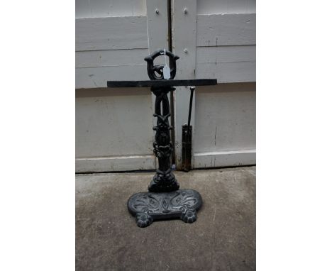 A cast iron stick stand. 