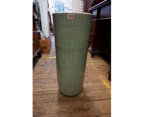 A Chinese celadon stick stand,&nbsp;with moulded decoration, 60cm high.&nbsp; 