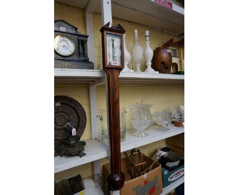 A reproduction mahogany and line inlaid stick barometer, the silvered dial inscribed 'Russell, Norwich'. 