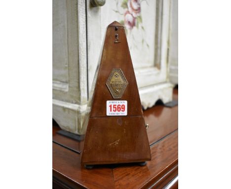 A Maelzel walnut cased metronome, No. 687450, 22cm high. 