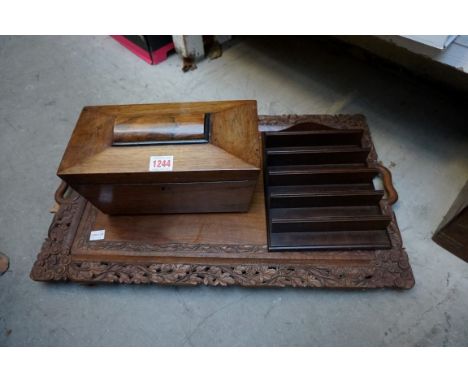 An Eastern carved walnut twin handled tray,&nbsp;61cm wide; together with an 19th century rosewood sarcophagus tea caddy; and
