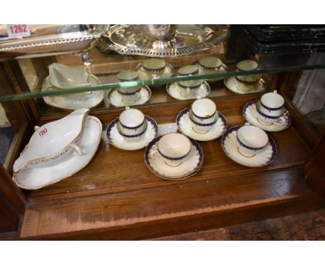 A KPM porcelain twin handled sauce boat and integral stand, 25.5cm wide; together with a collection of Worcester first period