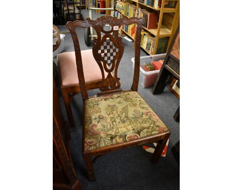 A 19th century carved walnut dining chair, in the manner of Thomas Chippendale, (some worm). 