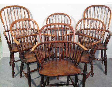 A HARLEQUIN SET OF 19TH CENTURY ASH AND ELM STICK BACKED ELBOW CHAIRS comprising two tall fireside type chairs, each with a c