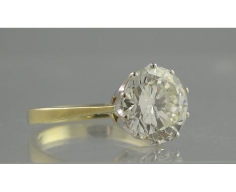 AN 18CT GOLD AND DIAMOND SOLITAIRE RING. Estimated diamond weight 3.61cts, clarity VS, colour L. Ring size M. Together with a