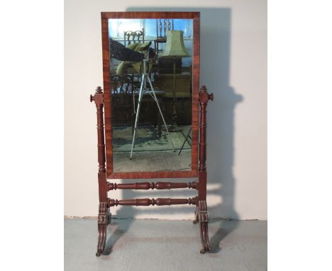 MID 19TH CENTURY MAHOGANY CHEVAL MIRROR having rectangular plate with swept frame supported on ring turned horns and a base w