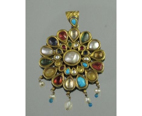 A 19TH CENTURY INDIAN MULTI GEM AND ENAMEL NAVRATAN STYLE PENDANT of circular form. Set with various gemstones including blis