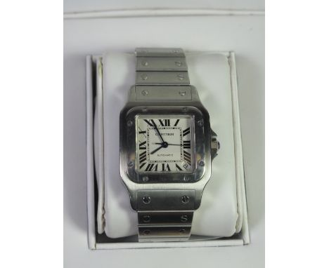 A CARTIER STAINLESS STEEL GENTLEMAN'S AUTOMATIC 'SANTOS' BRACELET WRISTWATCH with white face having Roman Numerals, date aper