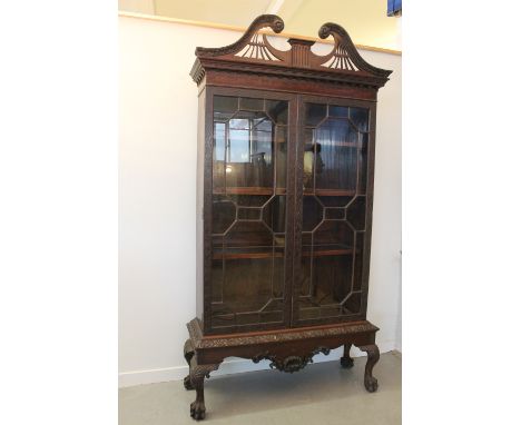 CHIPPENDALE DESIGN MAHOGANY GLAZED DISPLAY CABINET having pierced and moulded broken swan neck pediment over dentil frieze wi