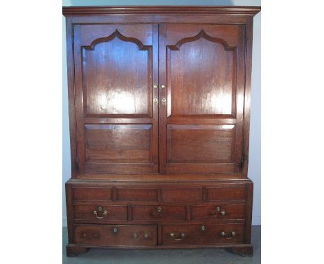 18TH CENTURY WELSH OAK TWO STAGE HANGING CUPBOARD having moulded cornice over two single ogee pointed arch panel doors, on a 