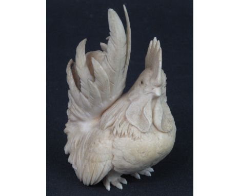 WELL CARVED JAPANESE IVORY STUDY OF A COCKEREL with large comb and displaying tail. Signature to base. 4" high (105mm).  COND