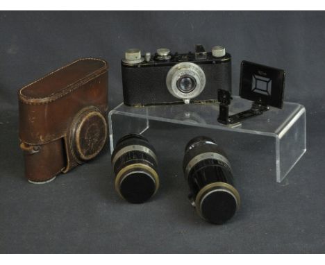 A LEICA M1 STANDARD NON RANGE FINDER 35MM CAMERA with black enamelled frame and leather covered body, Leitz Elmar F 50mm lens