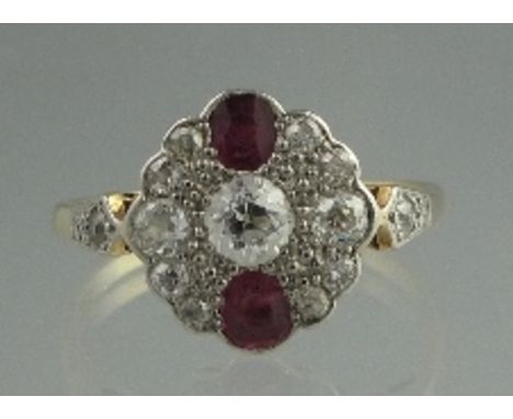 AN ART DECO 18CT GOLD RUBY AND DIAMOND RING in oval shaped setting with diamond set shoulders. Ring size R.  CONDITION REPORT