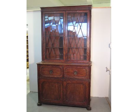 19TH CENTURY MAHOGANY SECRETAIRE BOOKCASE the top having moulded cornice over reeded pilasters, two astragal glazed doors rev