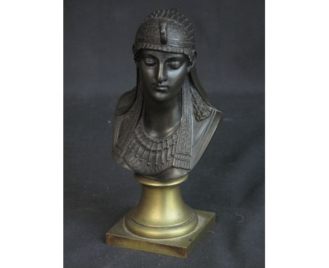 FRENCH SCHOOL (19TH CENTURY) PORTRAIT BUST OF AN EGYPTIAN WOMAN with bird headdress, patinated bronze on polished bronze socl