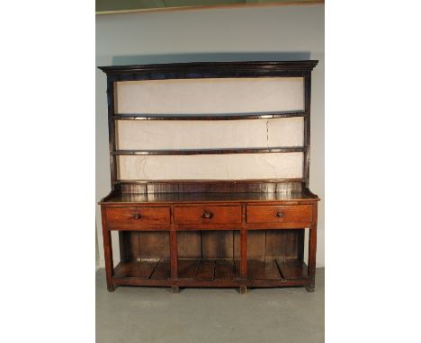 EARLY 19TH CENTURY WELSH OAK POT BOARD DRESSER having boarded two shelf rack back under a moulded cornice with iron hooks, th