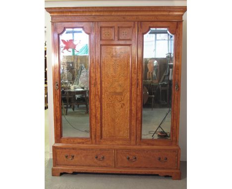 GOOD QUALITY EARLY 20TH CENTURY INLAID SATIN WOOD THREE SECTION WARDROBE having moulded dentil cornice over foliate inlaid ce