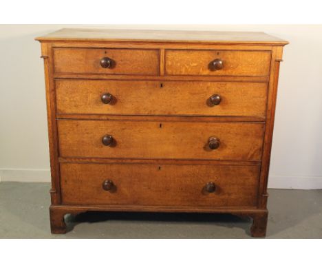 MID 19TH CENTURY WELSH OAK STRAIGHT FRONTED CHEST of two short and three long graduated and cock beaded drawers with mahogany