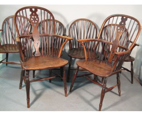 HARLEQUIN SET OF 19TH CENTURY ASH AND ELM HOOP BACKED ELBOW CHAIRS comprising four similar low chairs with differing leg turn