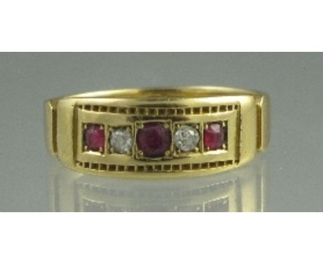 AN EDWARDIAN 18CT GOLD RUBY AND DIAMOND RING. Set with three rubies and two diamonds. Ring size M.  CONDITION REPORT: In good