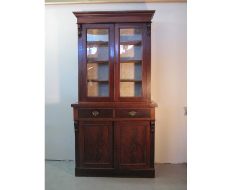 LATE VICTORIAN MAHOGANY CHIFFONIER BOOKCASE moulded cornice over two glazed doors revealing fitted shelve to the interior and